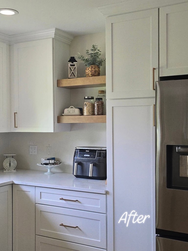 Floating wood shelves and pantry cabinets beside the refrigerator
