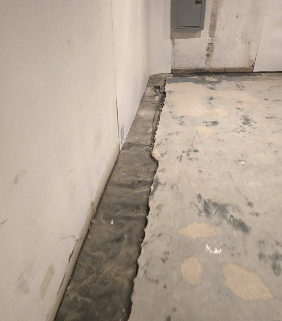 Sump pump basin and edges sealed during basement waterproofing