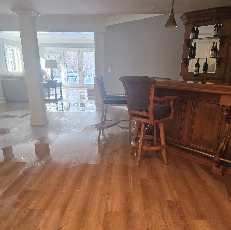Flooded basement floor before water mitigation and cleanup